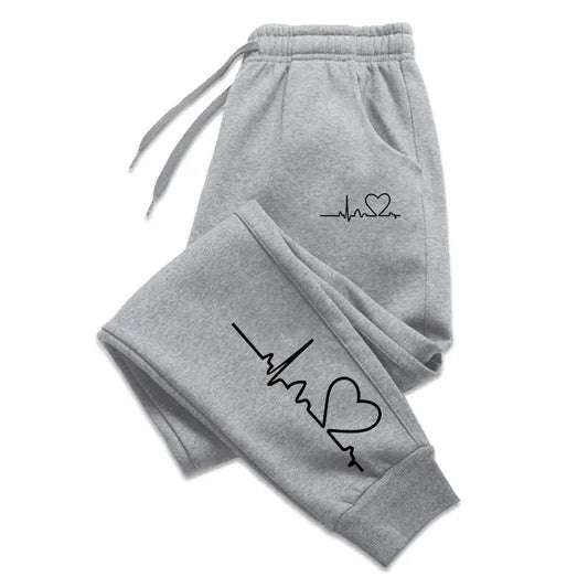 Stylish 3Sixty5 everyday glam track pants in gray featuring heart and heartbeat graphic design