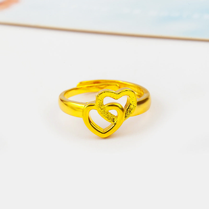 Gold plated brass ring with intertwined heart design for trendy fashion lovers