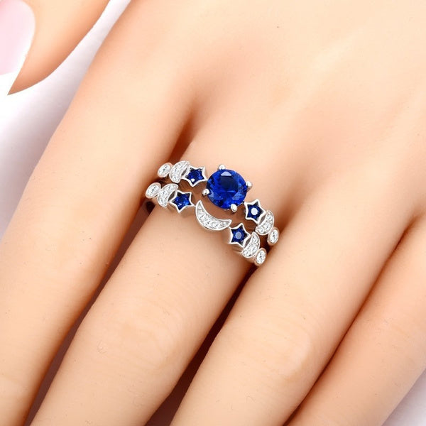 Stylish 3Sixty5 moon and star ring design featuring a blue gemstone and intricate details