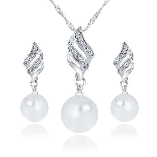 Elegant pearl jewelry gift set featuring a necklace and matching earrings with sparkling accents