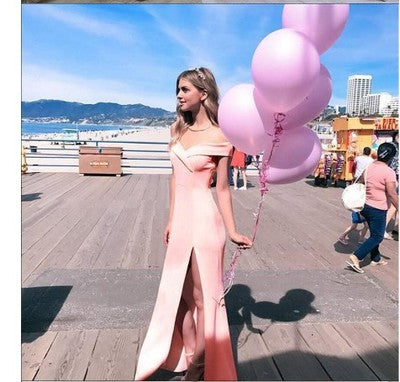 Stylish 3Sixty5 sunset breeze tube dress with a side slit, worn outdoors with pink balloons
