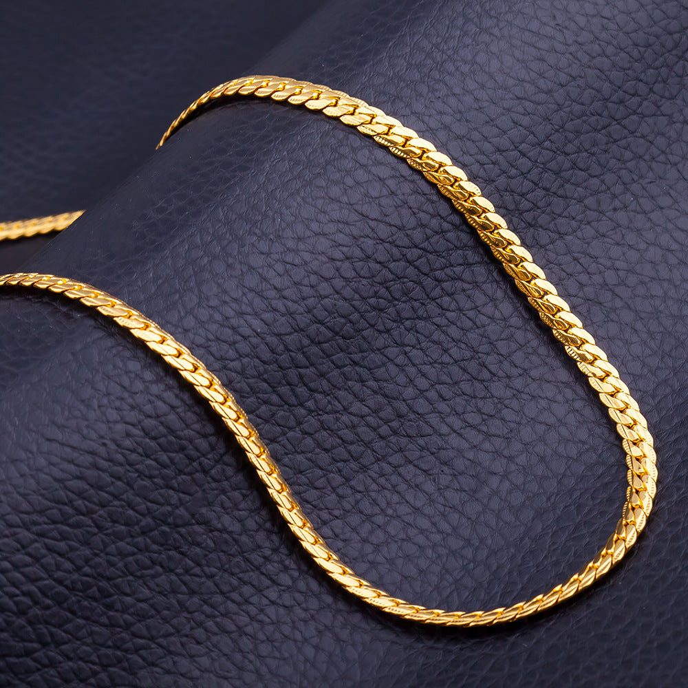 Stylish 3Sixty5 trendy gold chain displayed on a textured black background