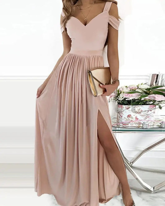 Elegant Grecian maxi dress in soft pink with off-the-shoulder straps and a stylish side slit
