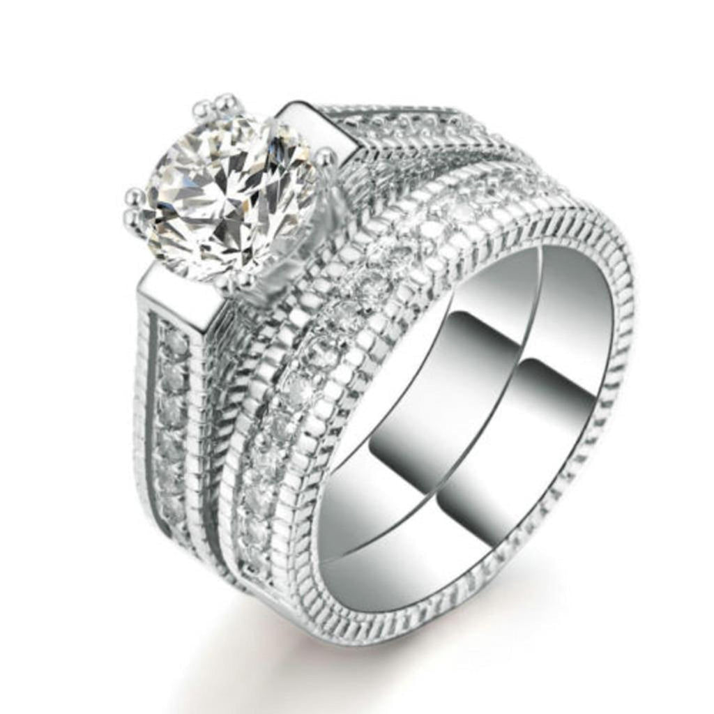 Stylish 3Sixty5 bold elegant diamond rings featuring a round center stone and intricate band design