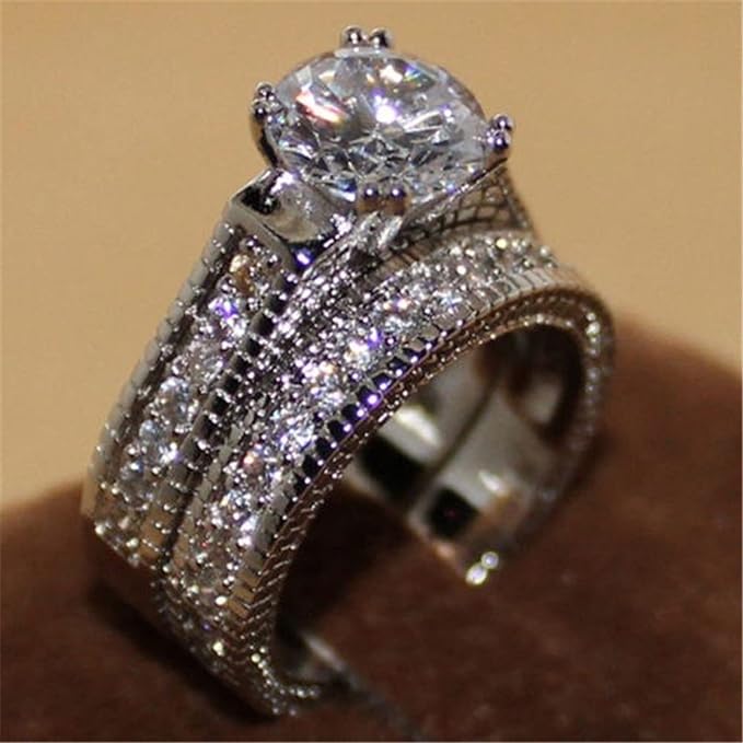 Stylish 3Sixty5 bold elegant diamond rings featuring a brilliant cut center stone with intricate setting details