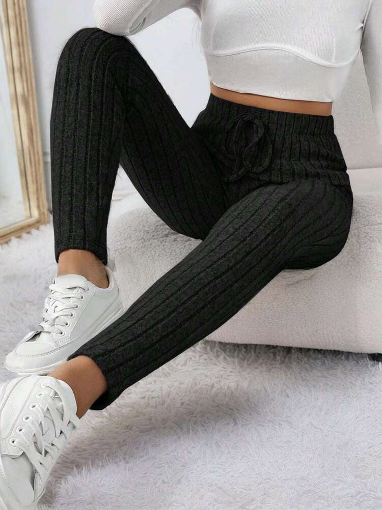 ChicStretch yoga pants in black with ribbed texture and high waist for active comfort