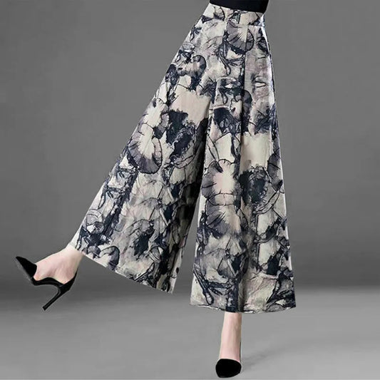 Elegant Stylish 3Sixty5 curve-hugging skirt with a floral abstract pattern and wide leg design
