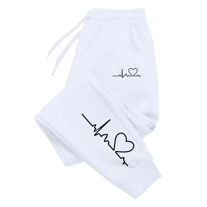 Stylish 3Sixty5 everyday glam track pants in white with heart and heartbeat graphic design