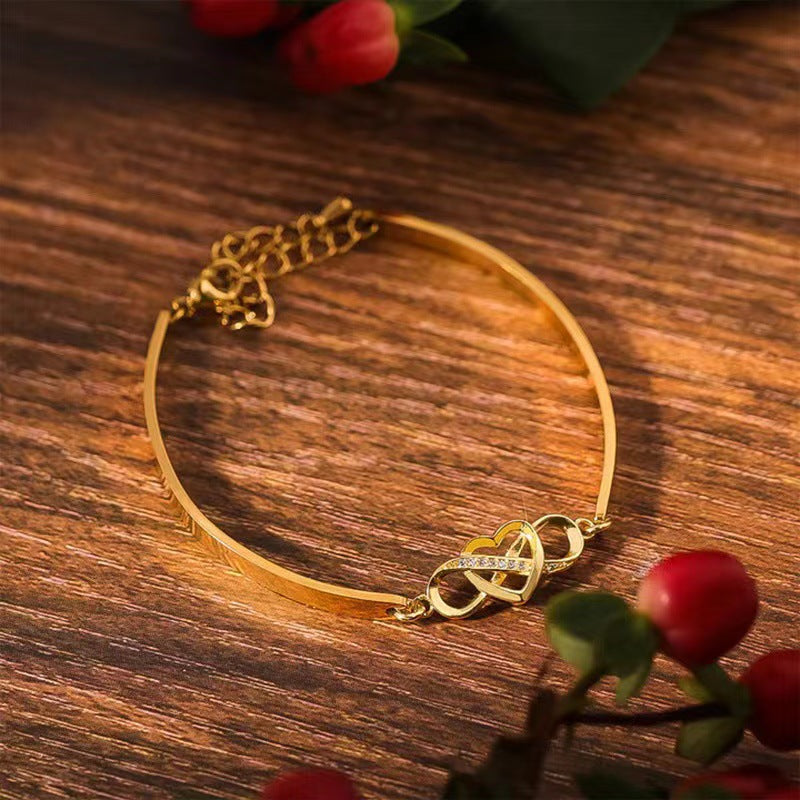 Gold forever love bracelet gift with an elegant intertwined design and sparkling accents