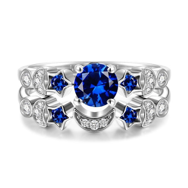 Stylish 3Sixty5 moon and star ring design with blue gemstones and sparkling accents