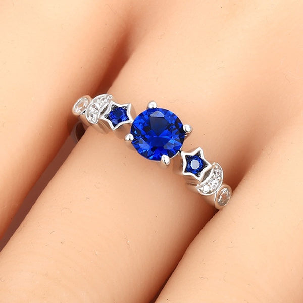 Stylish 3Sixty5 Moon and star ring design featuring a blue gemstone and sparkling accents