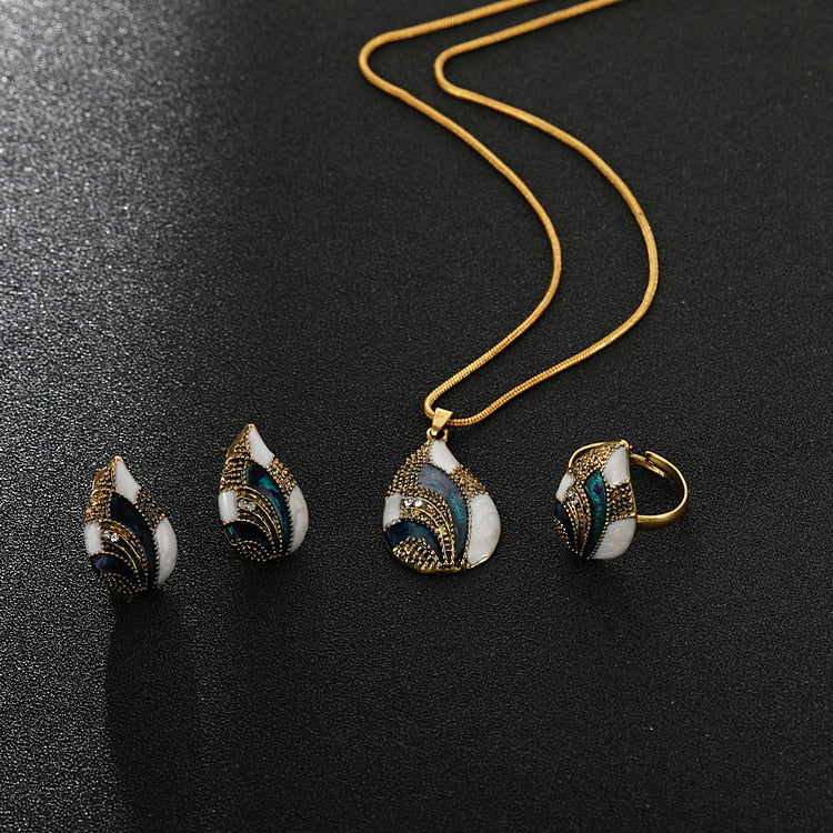 Ocean Mist Drop Jewelry Set featuring elegant earrings and a pendant on a gold chain perfect for any occasion
