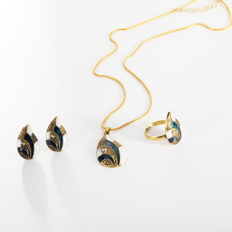 Ocean Mist Drop Jewelry Set featuring earrings, necklace, and ring with gold and blue accents