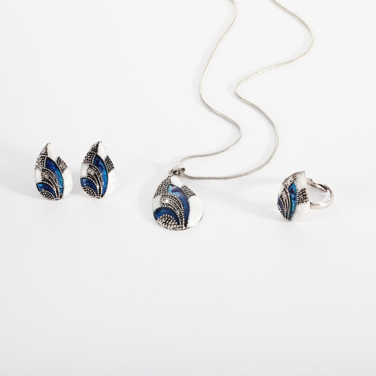 Ocean Mist Drop Jewelry Set featuring earrings, pendant, and ring with blue and white detailing