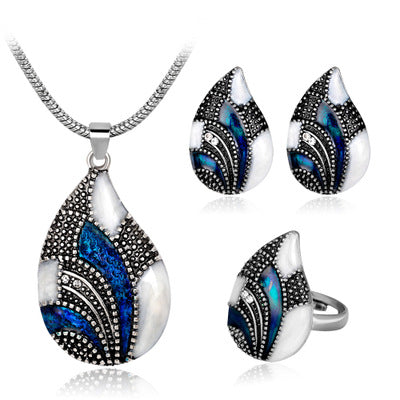 Ocean Mist Drop Jewelry Set featuring a necklace, earrings, and ring with elegant blue and black designs