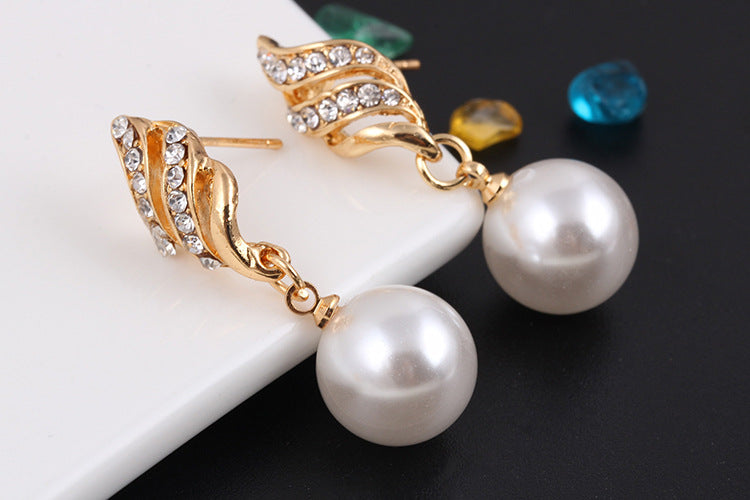 Elegant pearl jewelry gift set featuring stunning pearl drop earrings with gold accents and crystals