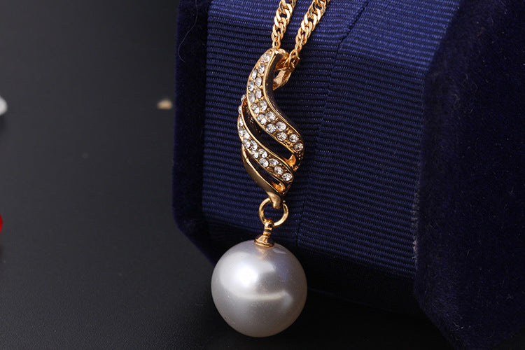Stylish 3Sixty5 pearl jewelry gift set featuring a pendant with gold and sparkling details