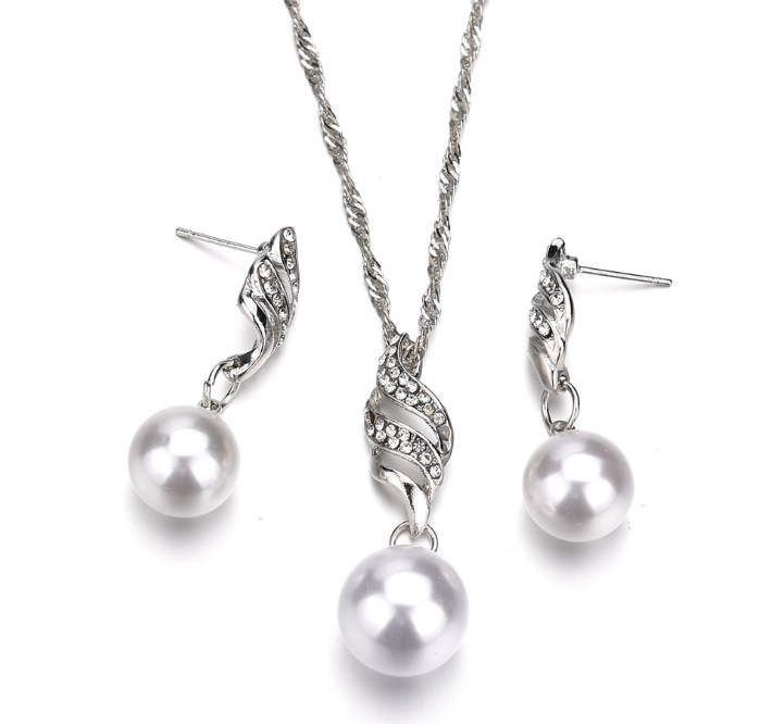 Elegant pearl jewelry gift set featuring a twisted necklace and matching earrings with sparkling accents