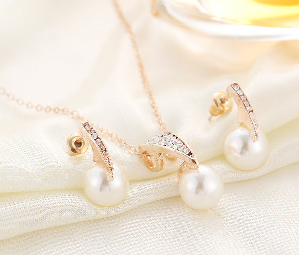 Pearl luxe duo jewelry set featuring elegant earrings and necklace with sparkling accents