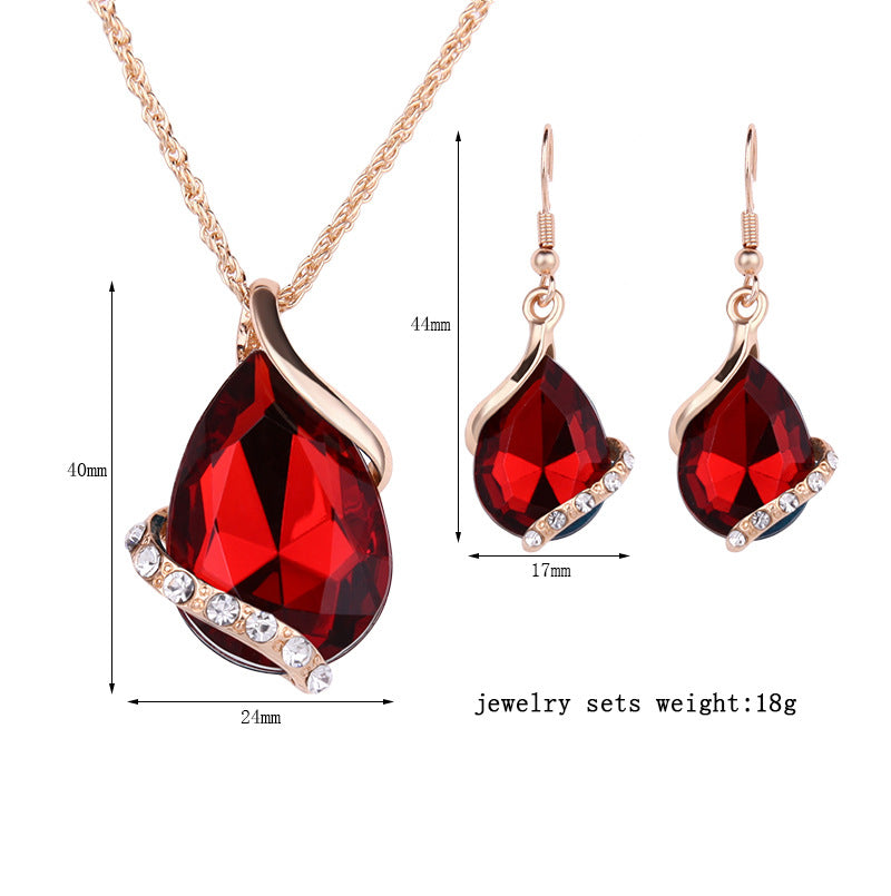 Royal dewdrop jewelry set featuring a stunning red pendant necklace and matching earrings