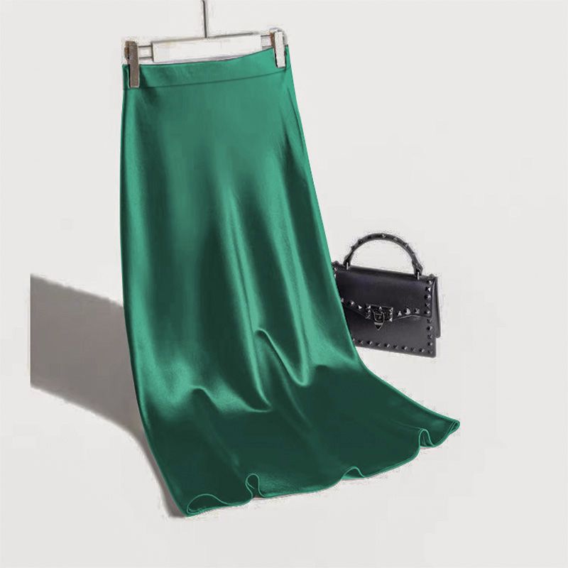 Elegant green satin straight skirt with a flowing design, perfect for stylish occasions