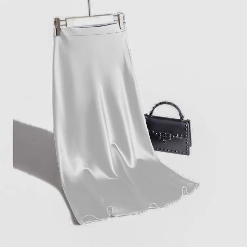 Stylish 3Sixty5 satin straight skirt in soft gray, perfect for elegant occasions and casual outings