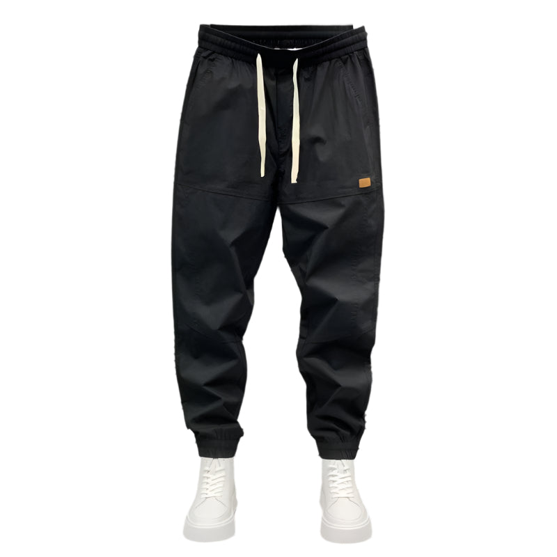Stylish 3Sixty5 seasonal ankle jogger pants in black with adjustable drawstring and side pockets