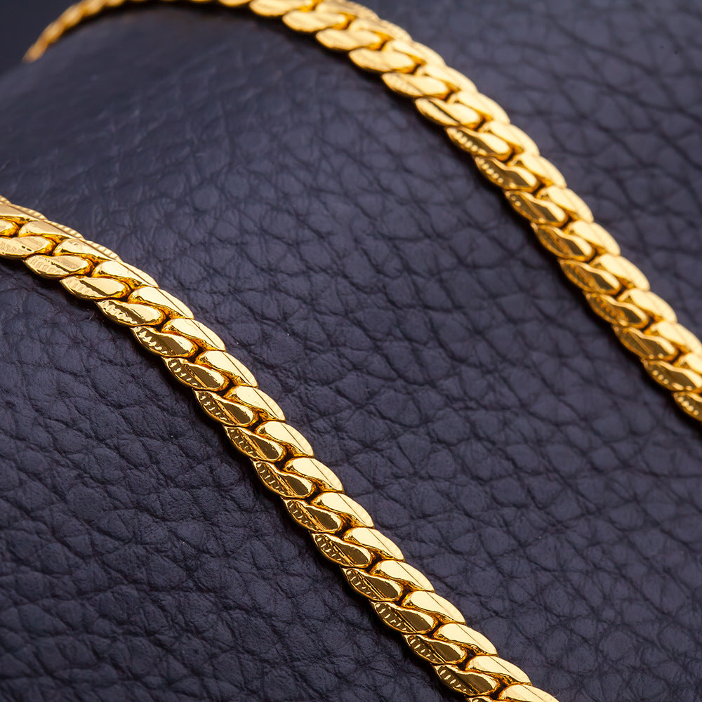 Stylish 3Sixty5 trendy gold chain necklace with a modern link design on a black background
