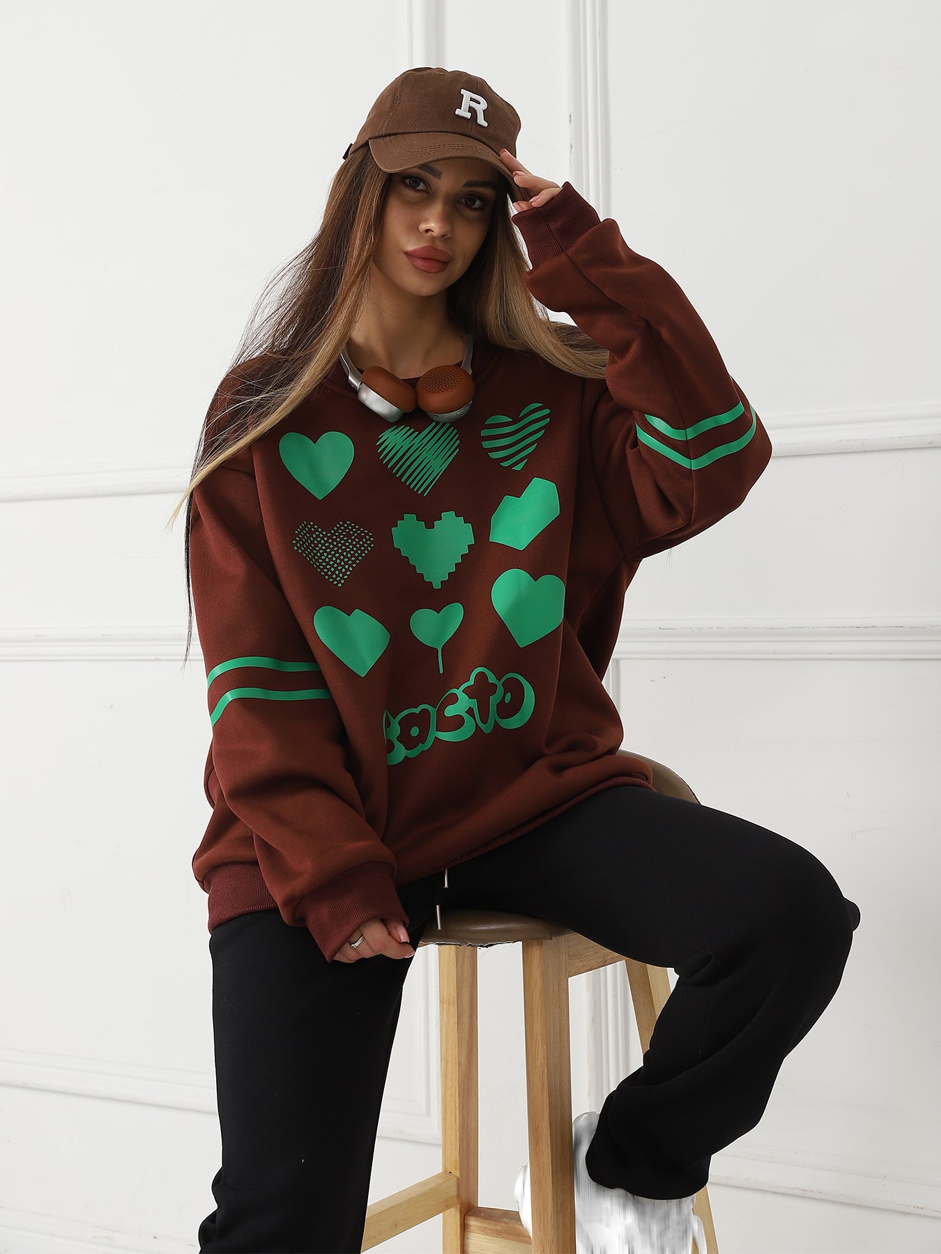 Stylish 3Sixty5 trendy heart sweater in brown with green heart patterns for a fashionable look