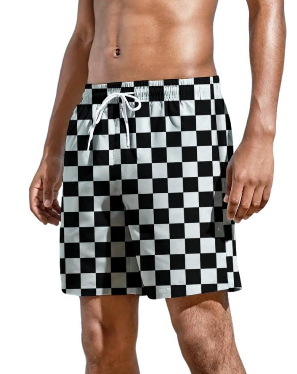 Trendy summer swimwear for men featuring a black and white checkerboard pattern