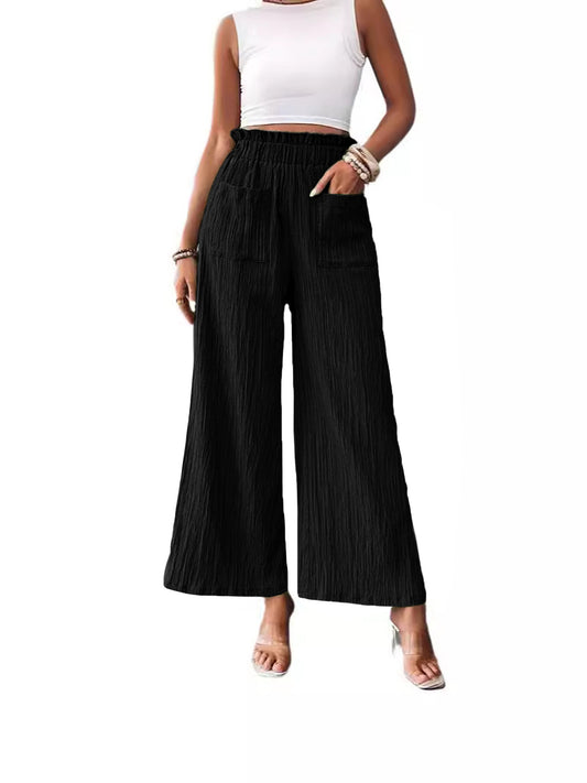 Woman wearing black Smooth Silhouette Pants with a relaxed fit and wide legs, perfect for stylish outfits
