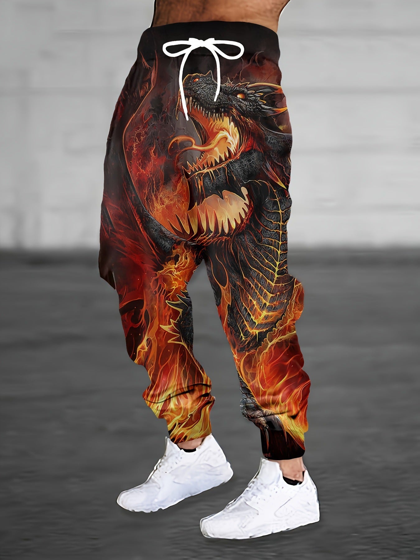 Vibrant print men's sweatpants featuring a fiery dragon design for a bold street style look